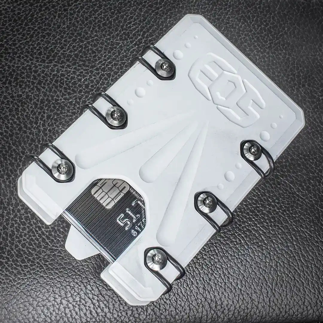 A white, rigid cardholder with black elastic bands and visible screws, designed to securely hold multiple cards.