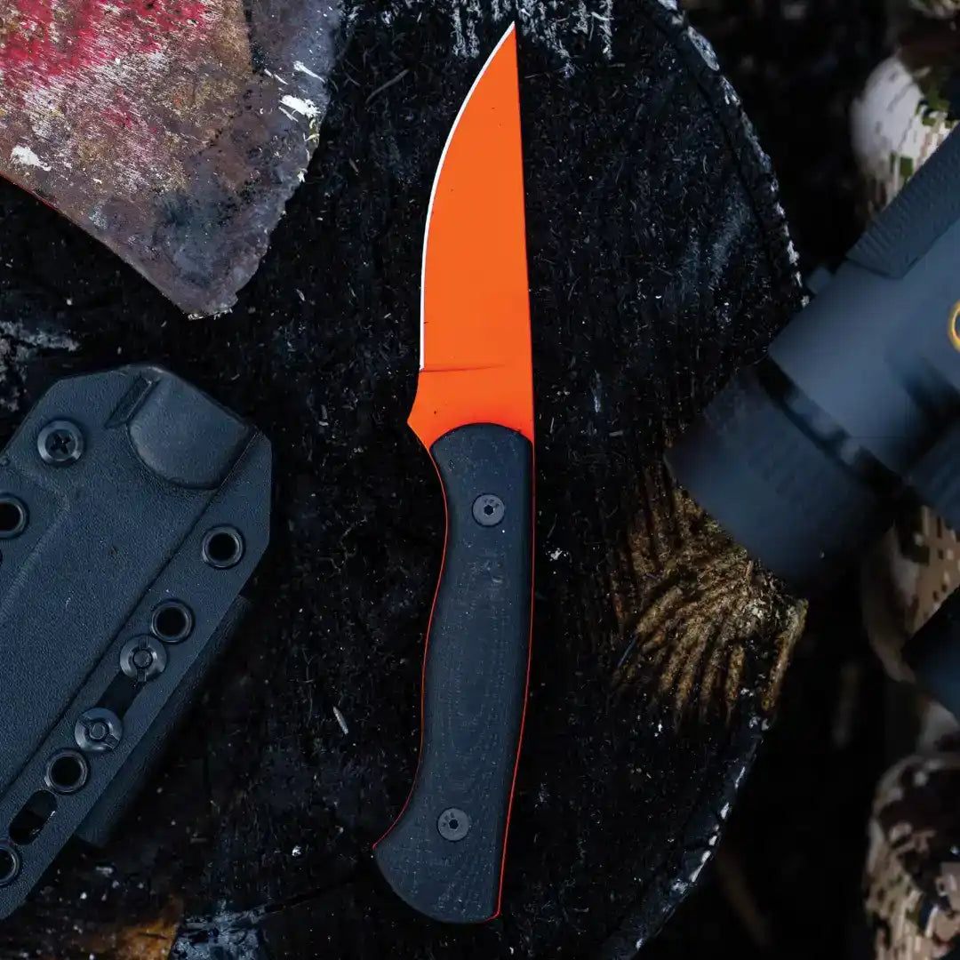 A fixed-blade knife with a bright orange blade and a black handle.
