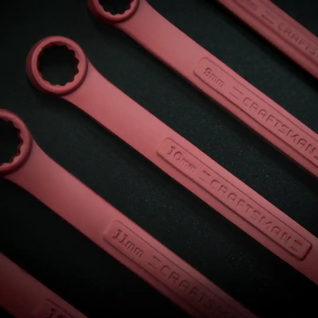 A set of red Craftsman box-end wrenches in various metric sizes.