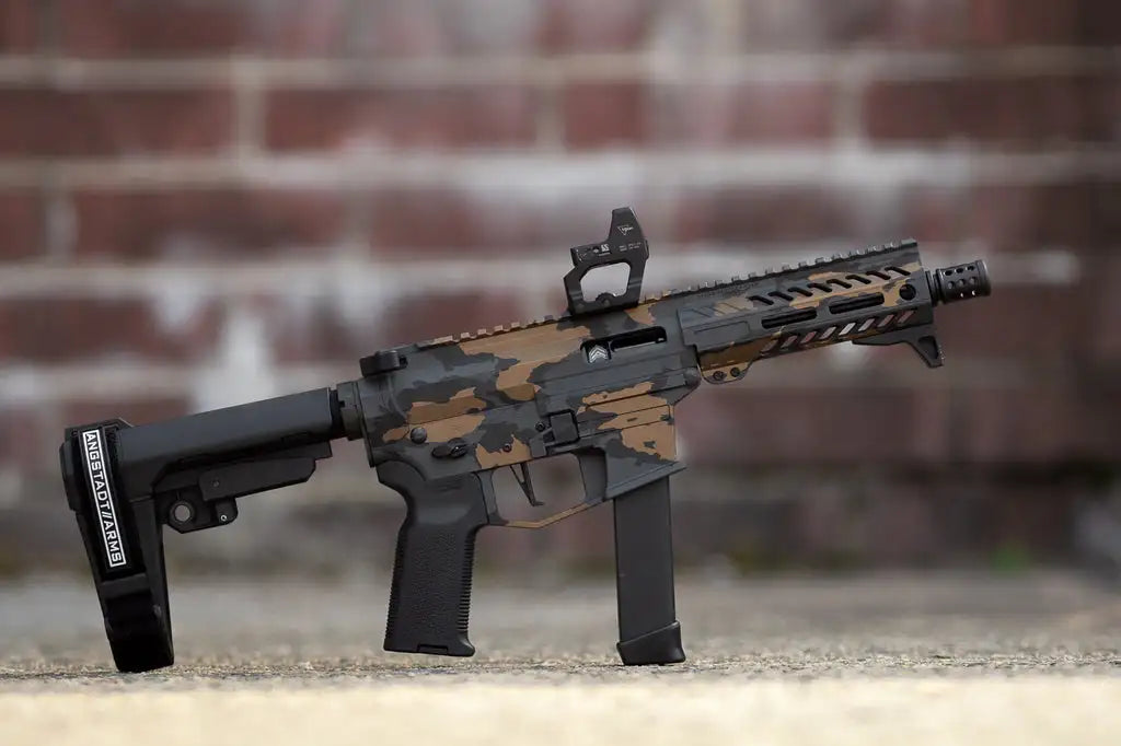 Camo ar-15 rifle with black and tan accents, made of metal and plastic.