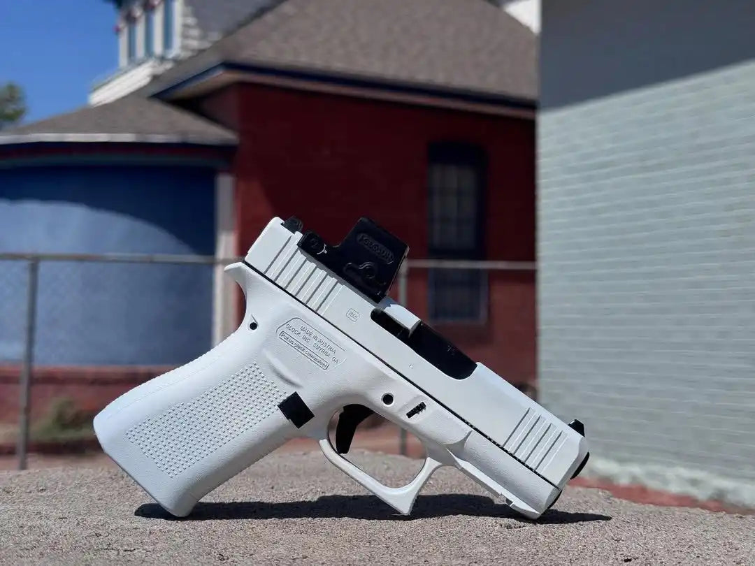 White glock handgun with black accents and grip texture.